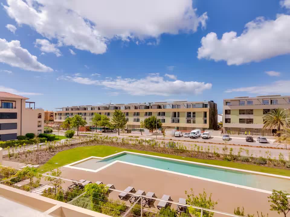 Outdoor pool surrounded by the modern buildings of The Nine Vilamoura